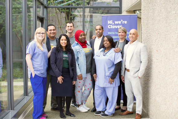 Group stands outside of a health fair